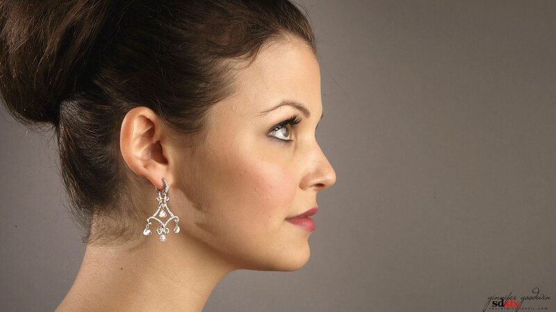 woman in profile with earrings