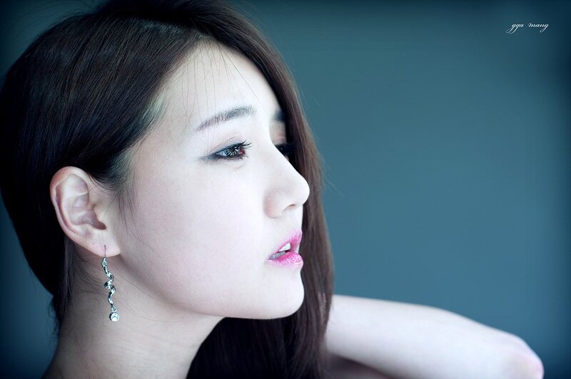 woman in profile with earrings
