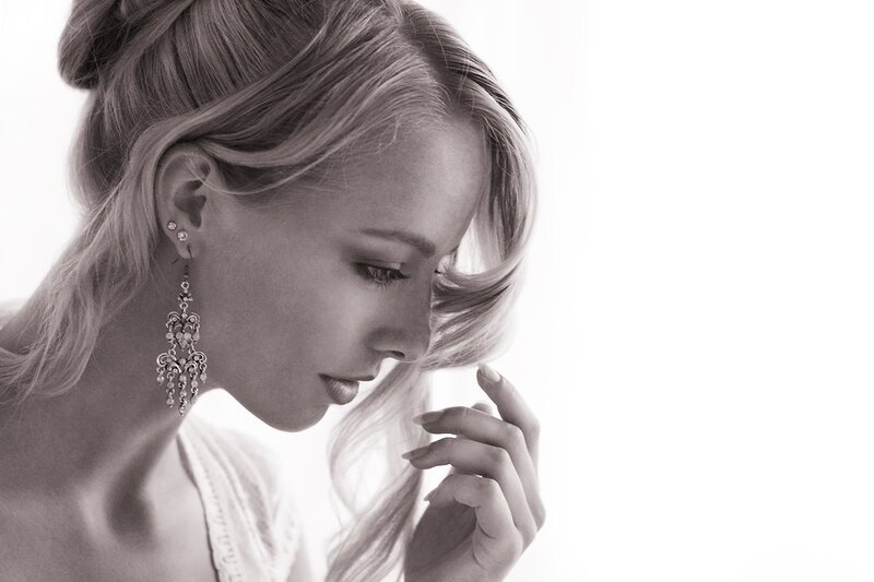 woman in profile with earrings