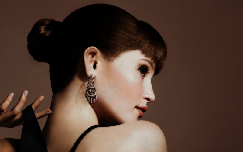 woman in profile with earrings