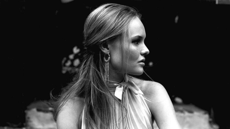 woman in profile with earrings