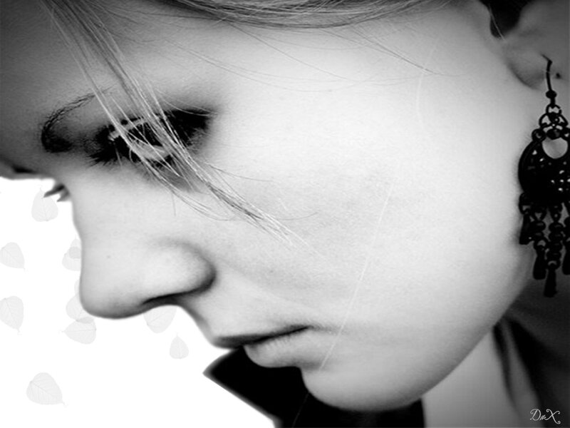 woman in profile with earrings