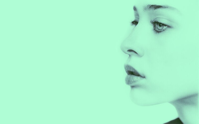 woman in profile with green tint