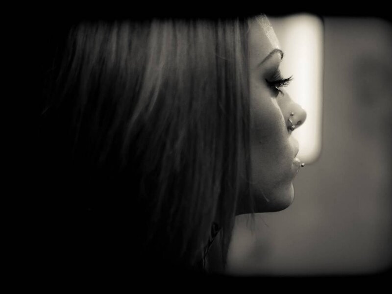 woman in profile with nose piercing