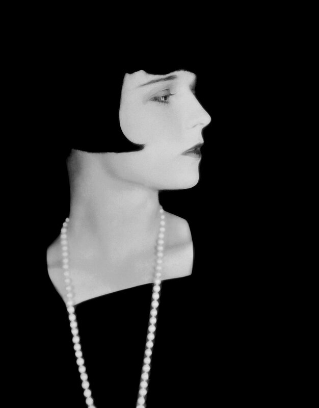 woman in profile with pearls