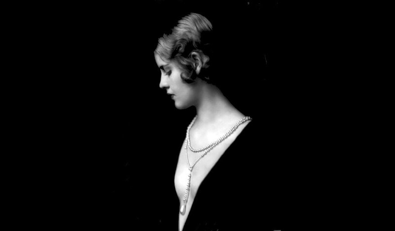 woman in profile with pearls