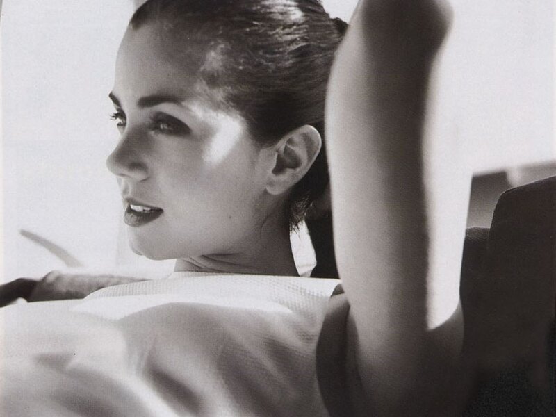 woman in profile with raised arm