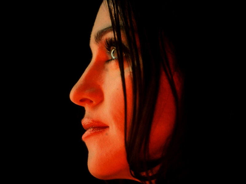 woman in profile with red light
