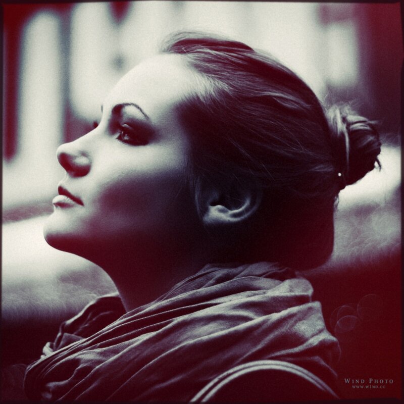 woman in profile with red tint