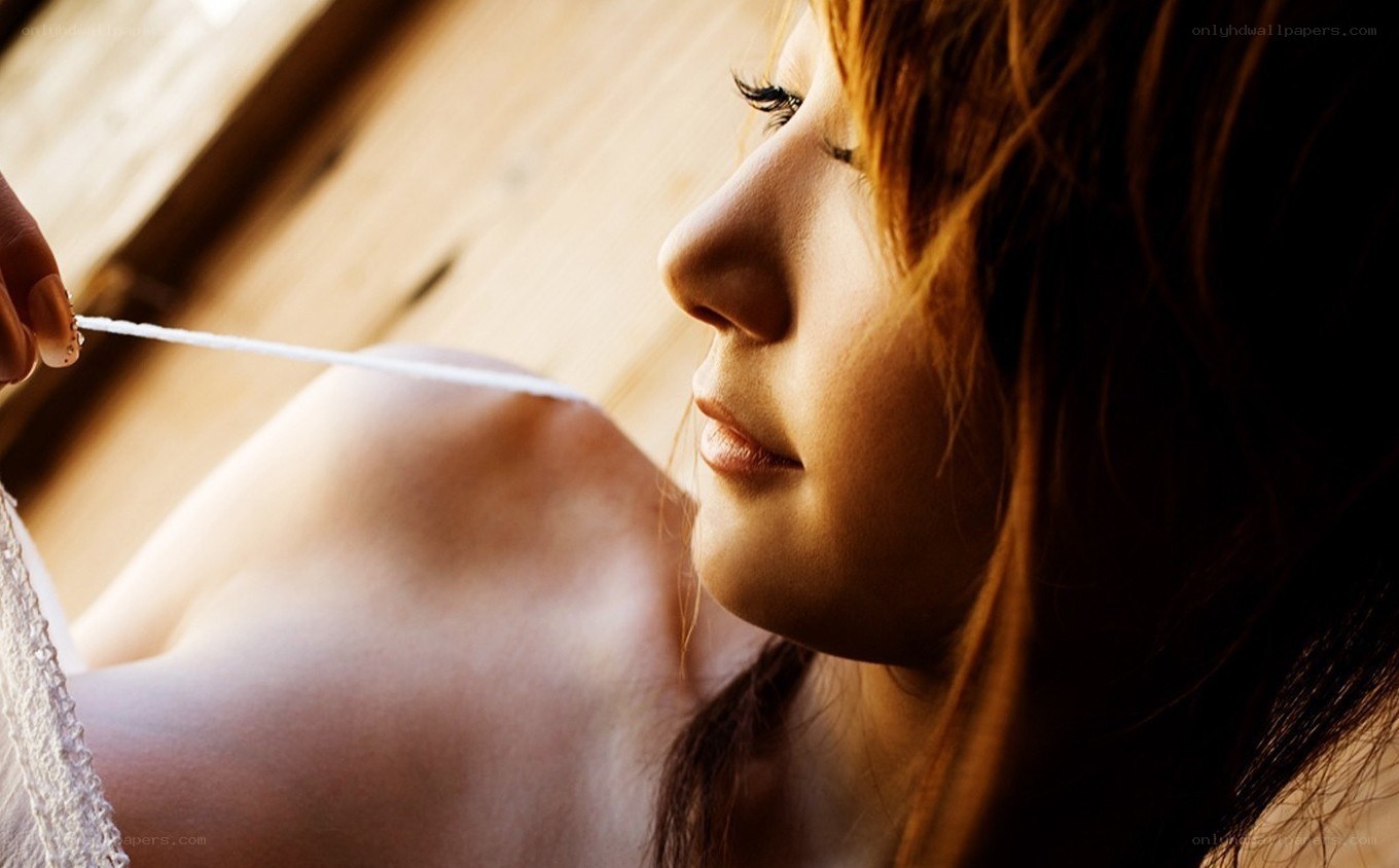 woman in profile with string