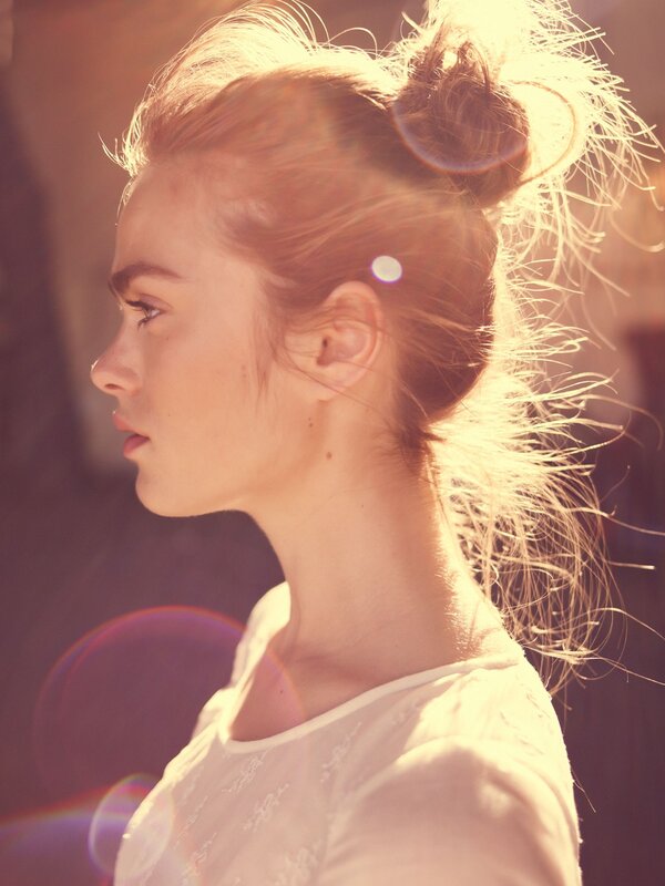 woman in profile with sun flare