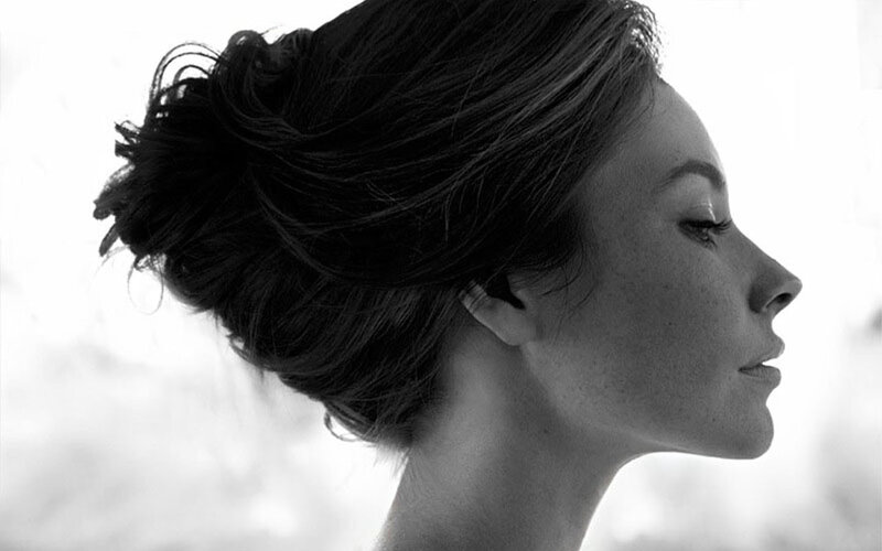 woman in profile with updo