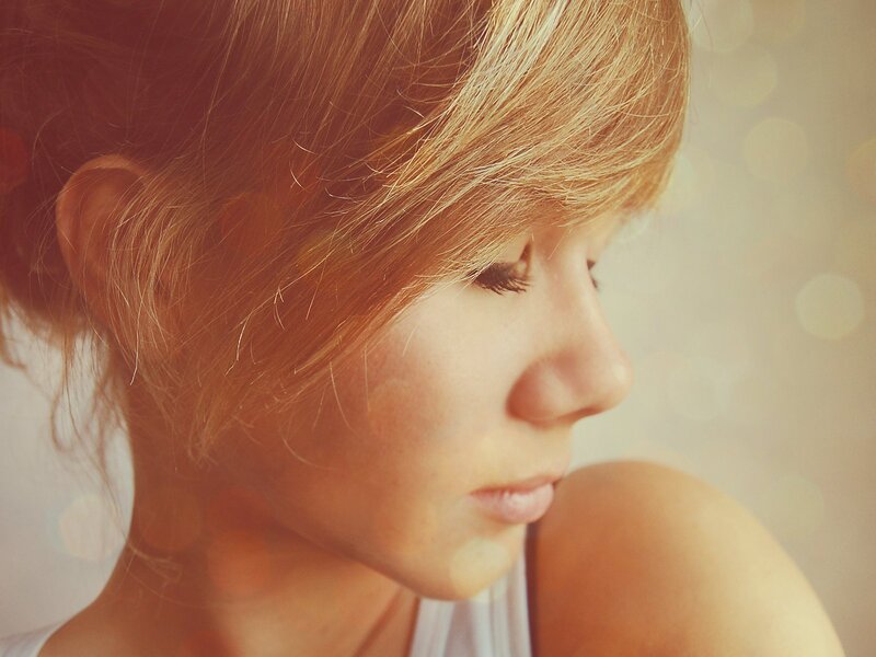 woman in profile with warm light