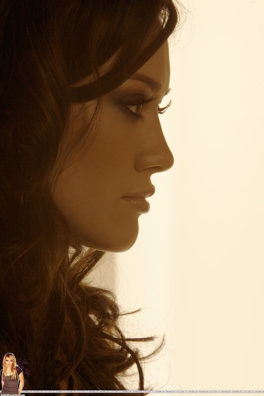 woman in profile with warm lighting