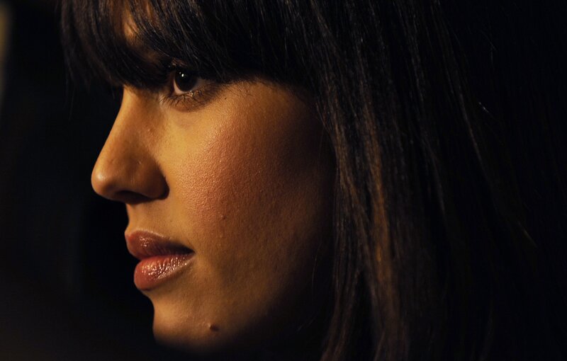 woman in profile with warm lighting