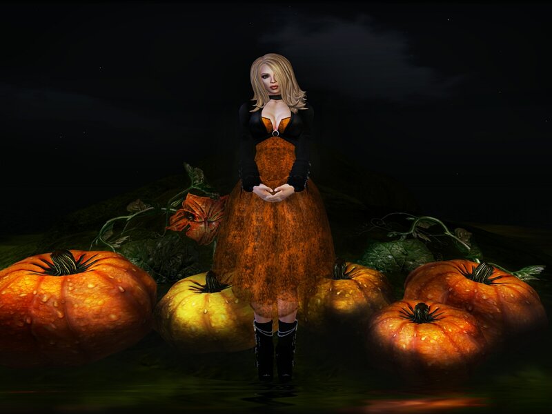 woman in pumpkin patch at night