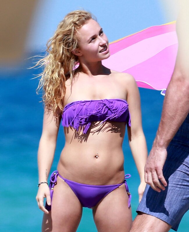Woman in purple bikini at beach