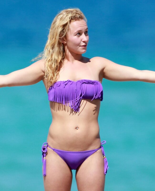 Woman in purple bikini at beach