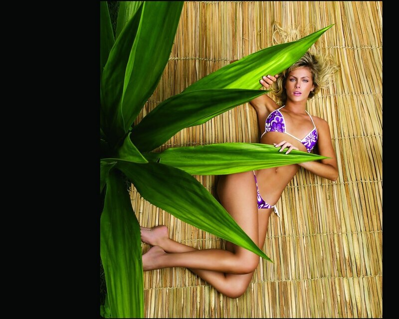 Woman in purple bikini on mat