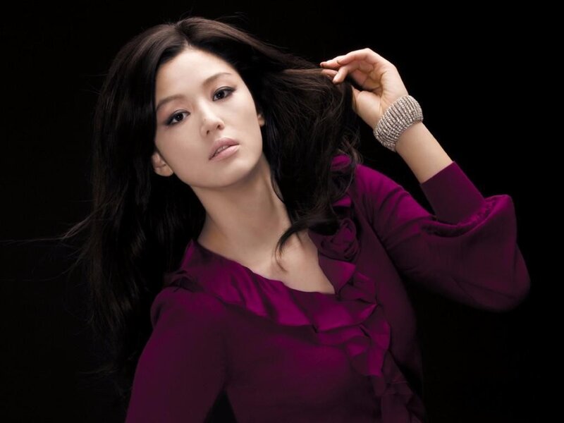 woman in purple blouse