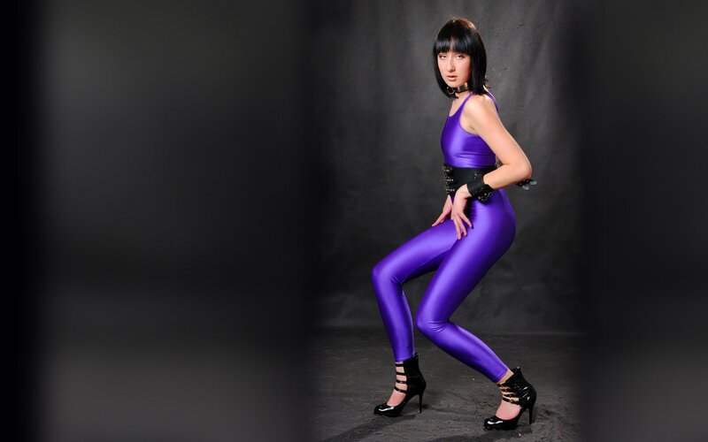 woman in purple bodysuit