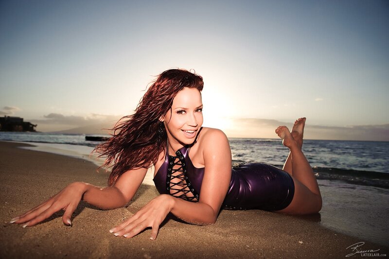 woman in purple bodysuit on beach