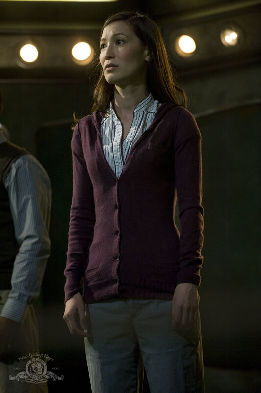 woman in purple cardigan