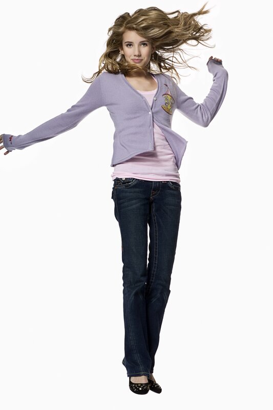 woman in purple cardigan jumping
