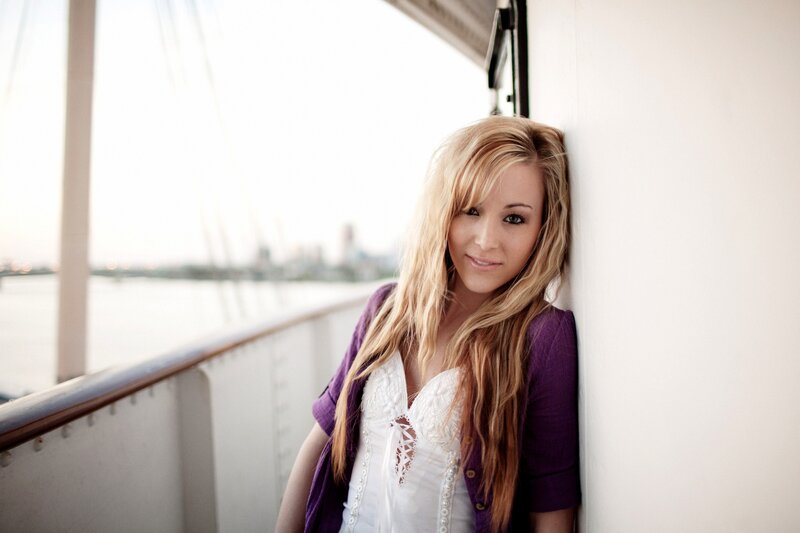 woman in purple cardigan on boat