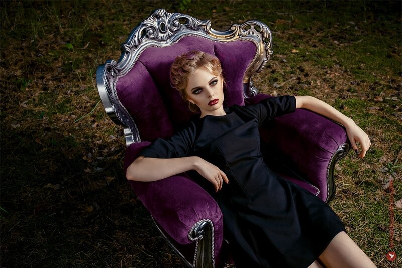 Woman in Purple Chair — Dramatic