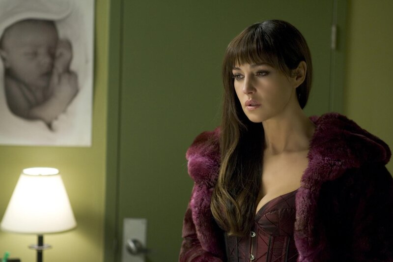 Woman in purple coat indoors
