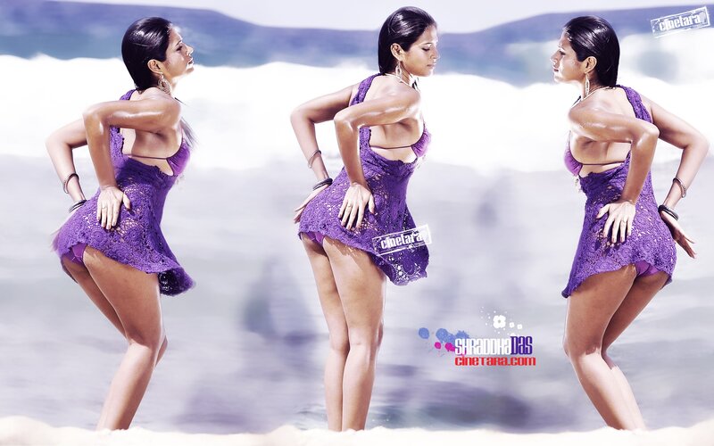 woman in purple dress at beach