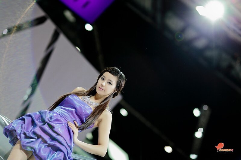 woman in purple dress at event