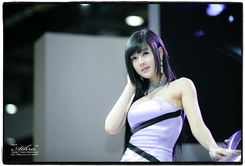 woman in purple dress at event