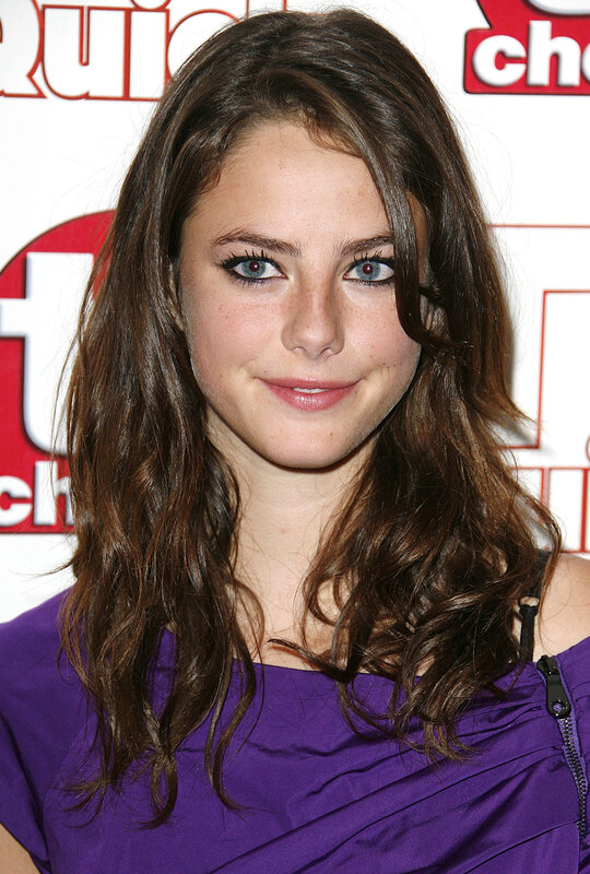 woman in purple dress at event