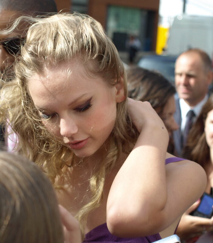woman in purple dress at event