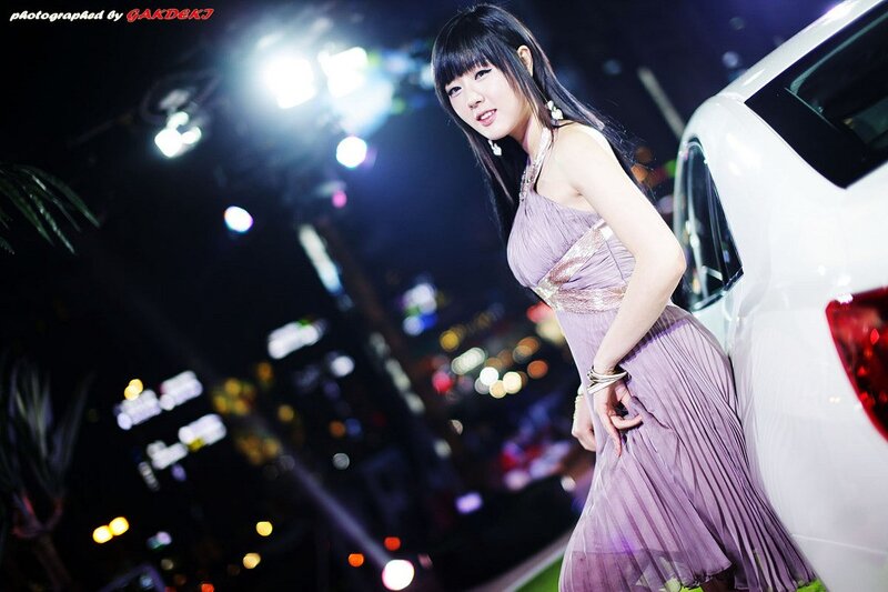 woman in purple dress at night