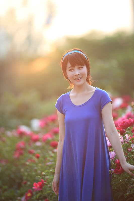 Woman in purple dress at sunset