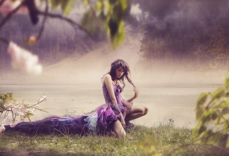 woman in purple dress by lake