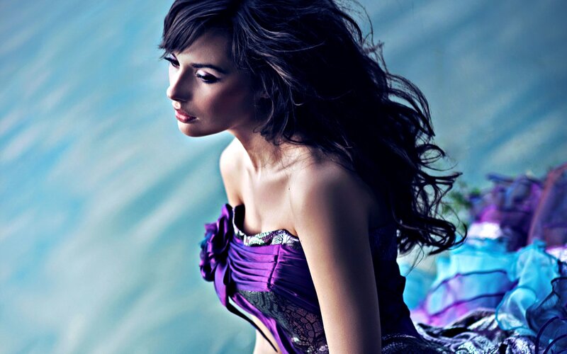 woman in purple dress by water