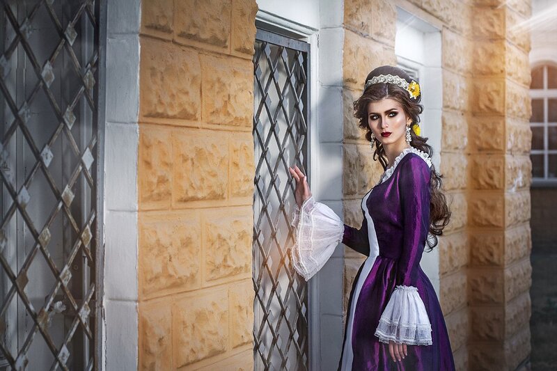 Woman in Purple Dress — Dramatic, Afternoon, Photograph, Stone Wall