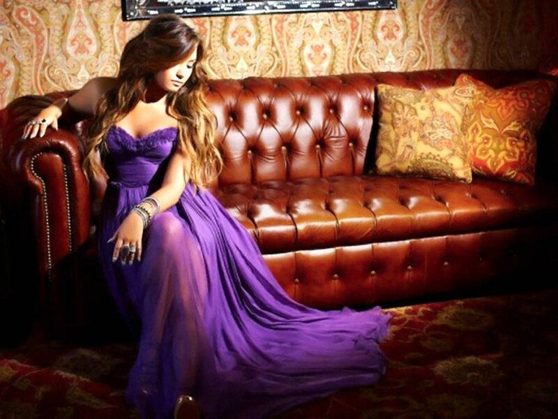 Woman in Purple Dress — Dramatic, Photograph, Couch, Pillows