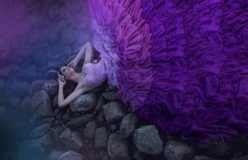 Woman in Purple Dress — Dramatic, Photograph, Rocks