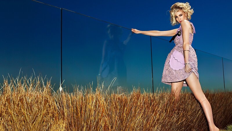 Woman in purple dress holding rope