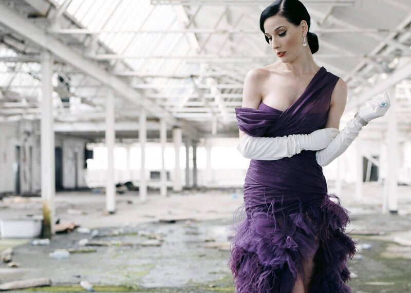 Woman in purple dress in warehouse