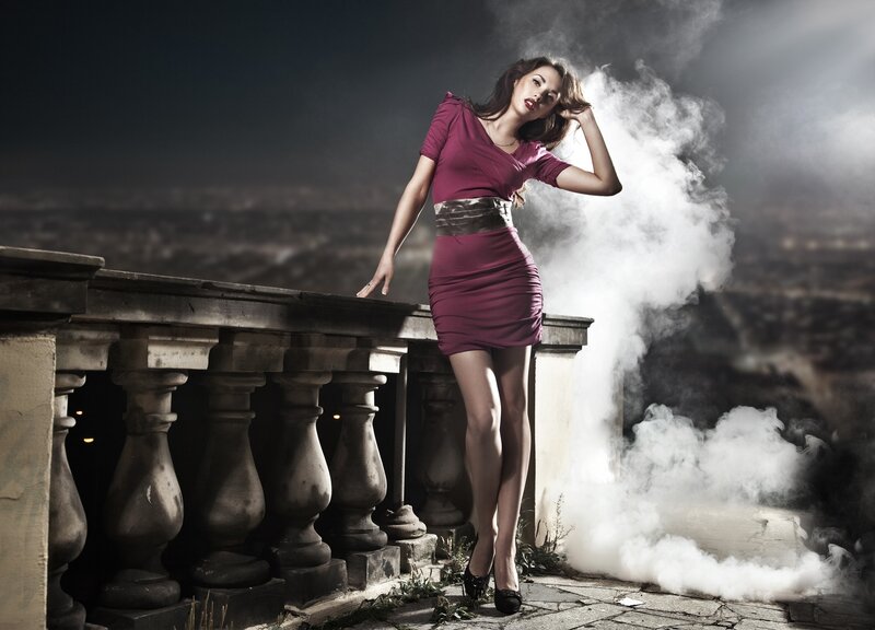 woman in purple dress on balcony