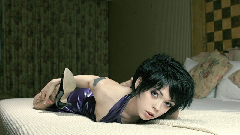 woman in purple dress on bed