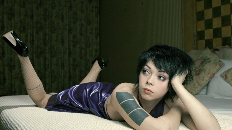 woman in purple dress on bed