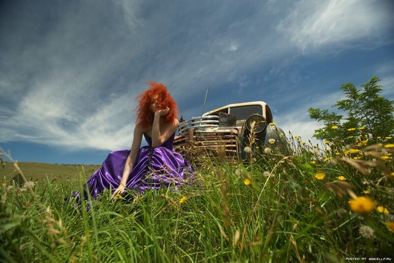 Woman in purple dress on hill