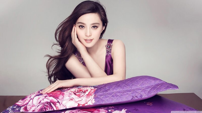 woman in purple dress on pillow